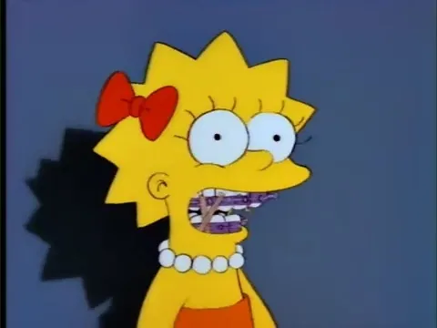 Lisa's school photo with her cheap braces resulting from her father's lack of a dental plan.